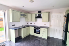  Greeen hand painted cupboards with black wortops in ballymoney 